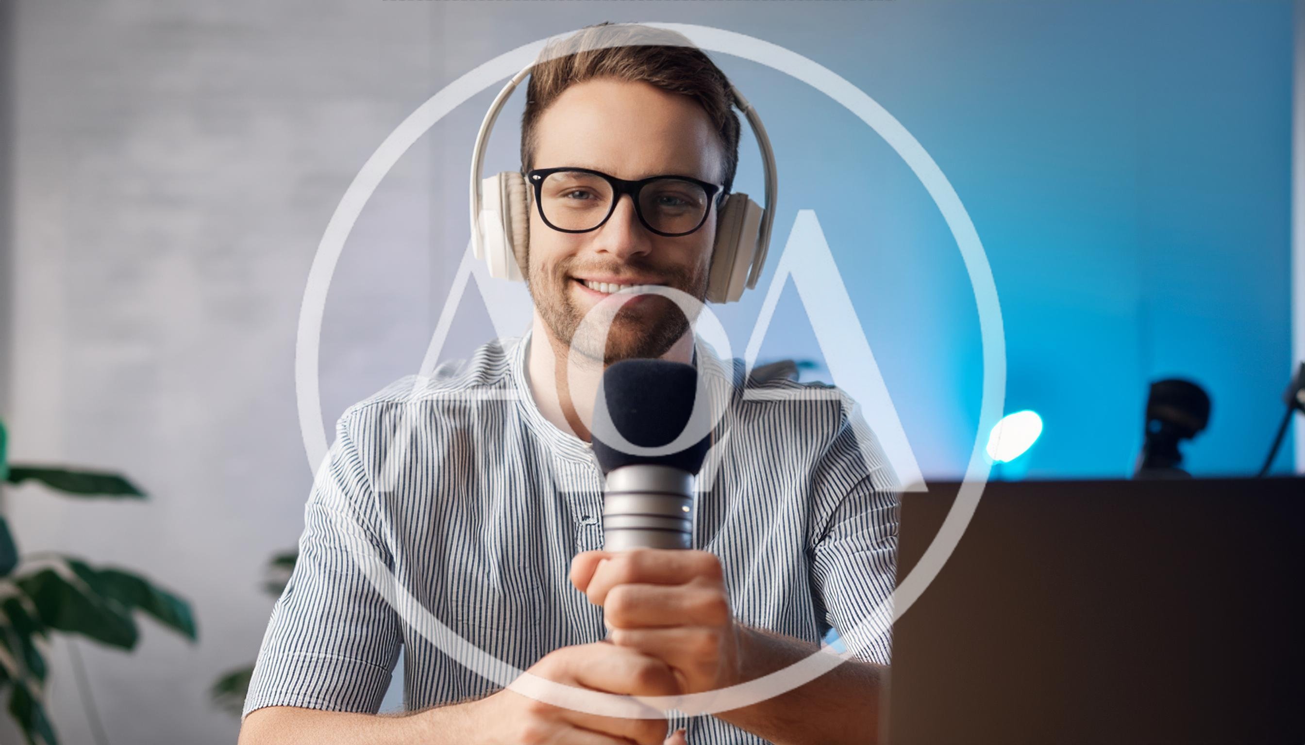 Young Man Recording Podcast With Microphone And Headphones