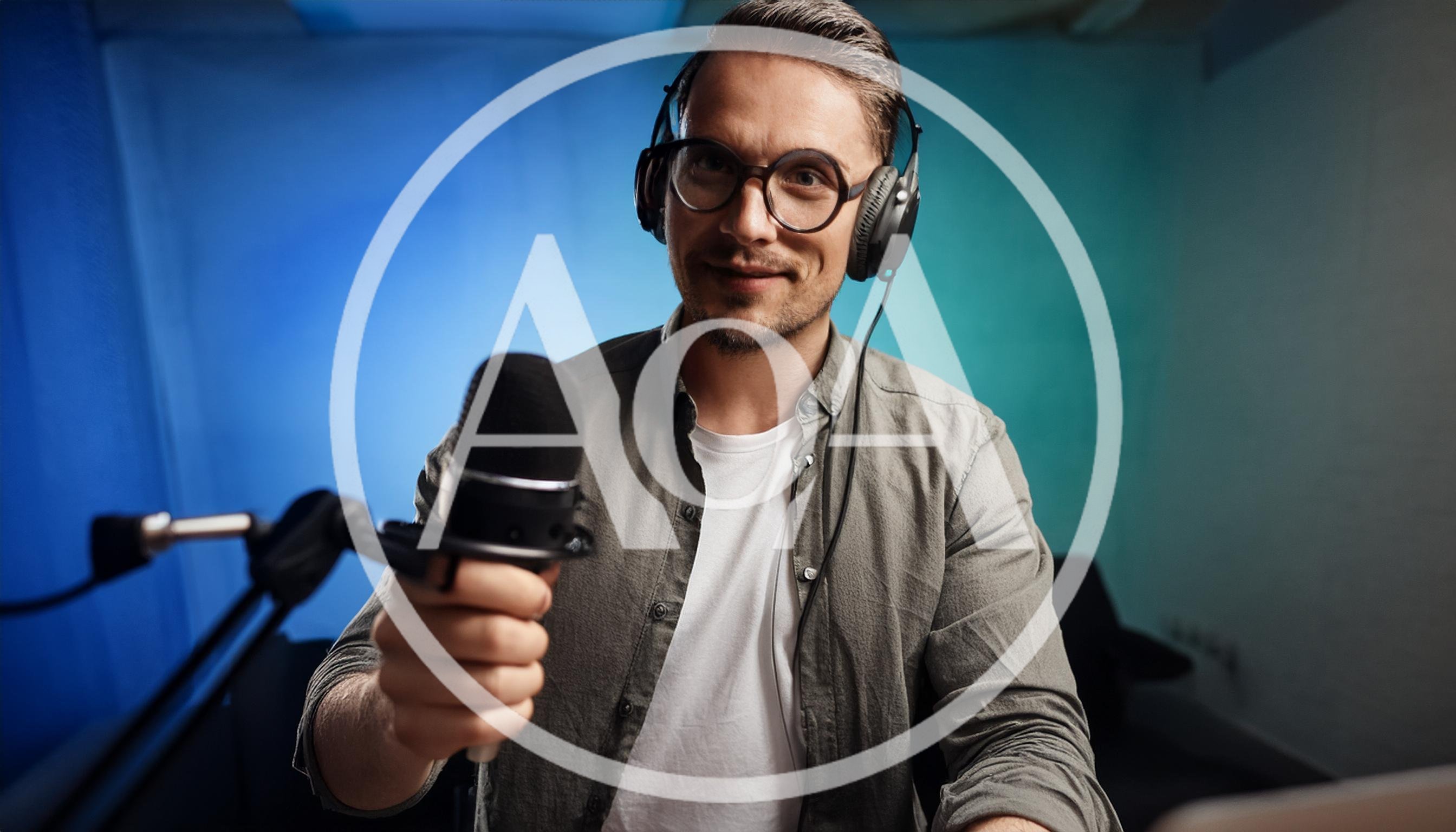 Podcaster Holding Microphone In Studio