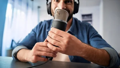 Podcaster Speaking Into A Professional Studio Microphone