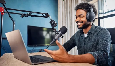 Young Man Recording A Podcast In Home Studio