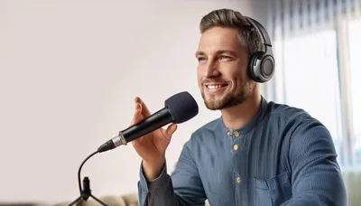 Man Recording Podcast With Microphone And Headphones