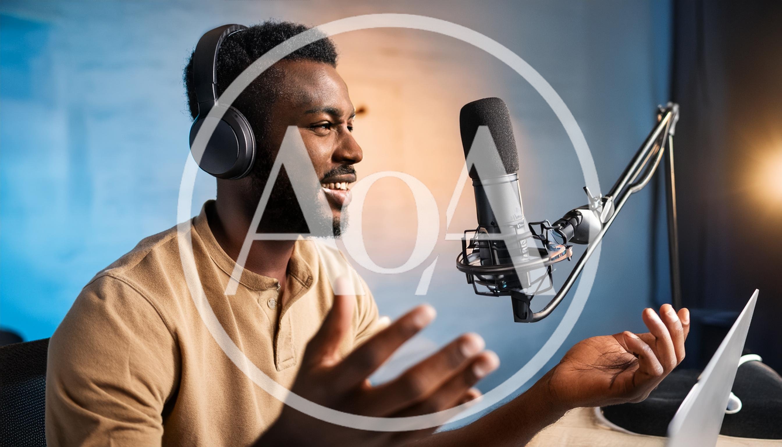 African American Podcaster Recording Audio In Studio