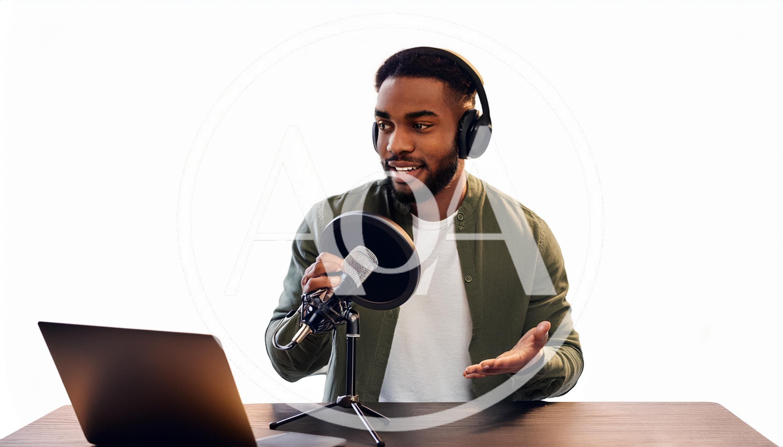 Young Black Man Recording Podcast With Laptop And Microphone