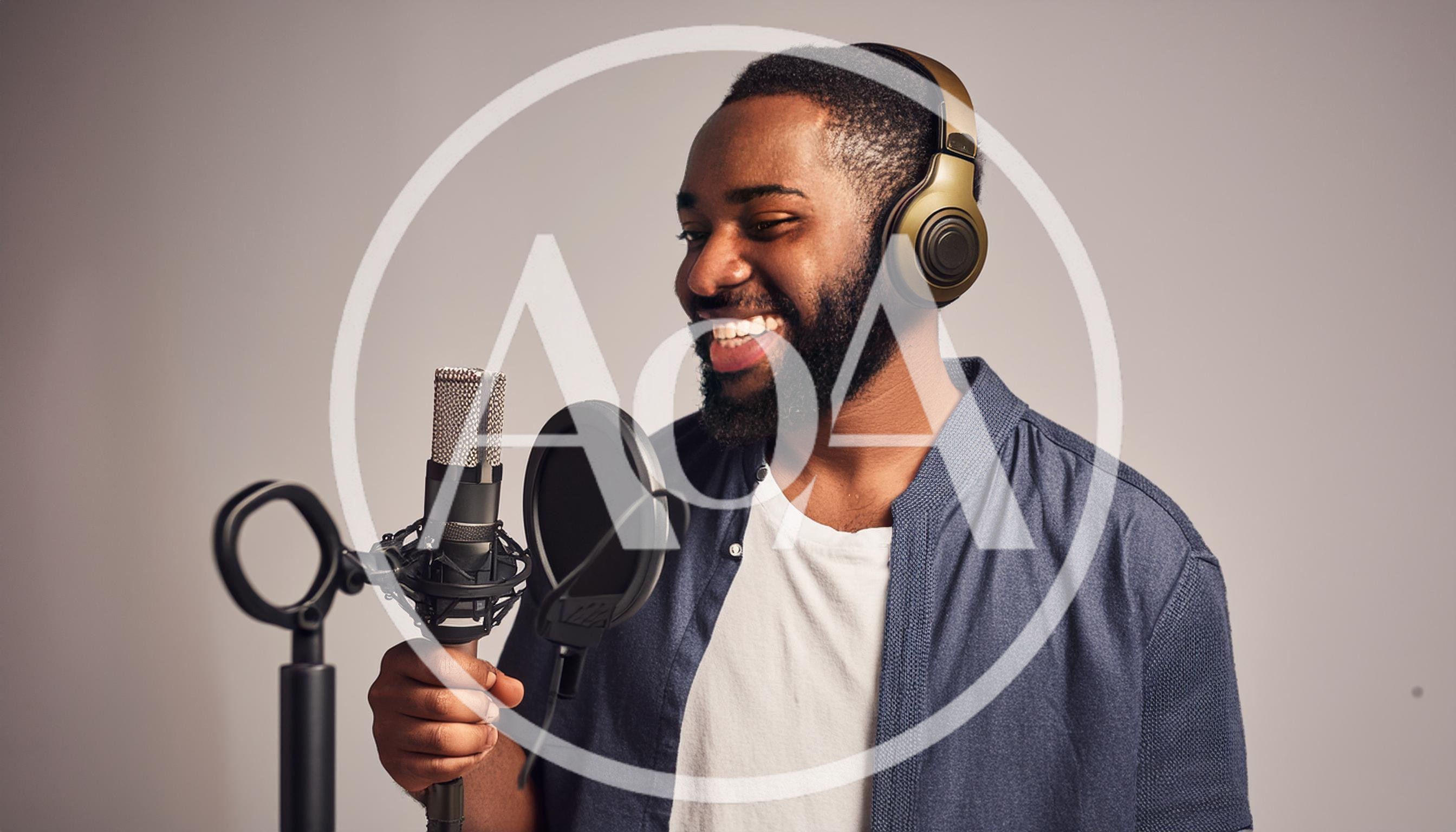 African American Man Recording Vocals In Professional Studio