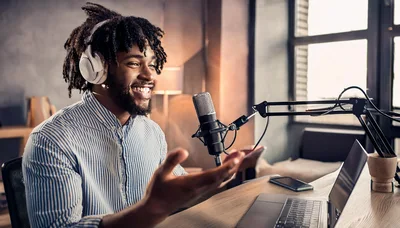 Young Man Recording A Podcast In A Home Studio