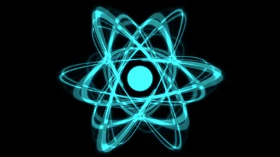 Glowing Blue Atom Model Rotating On Black Background
