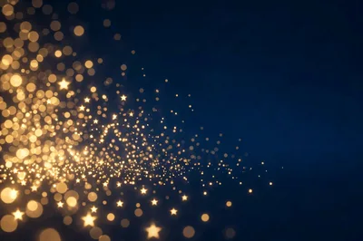 Golden Star Particles Floating On Dark Blue Background