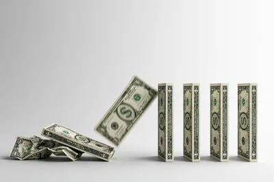 Dollar Bill Domino Effect Concept