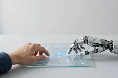 Human Hand And Robotic Hand Interacting On Digital Interface