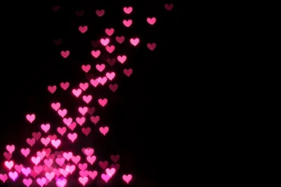 Pink Heart Bokeh Lights On Black Background