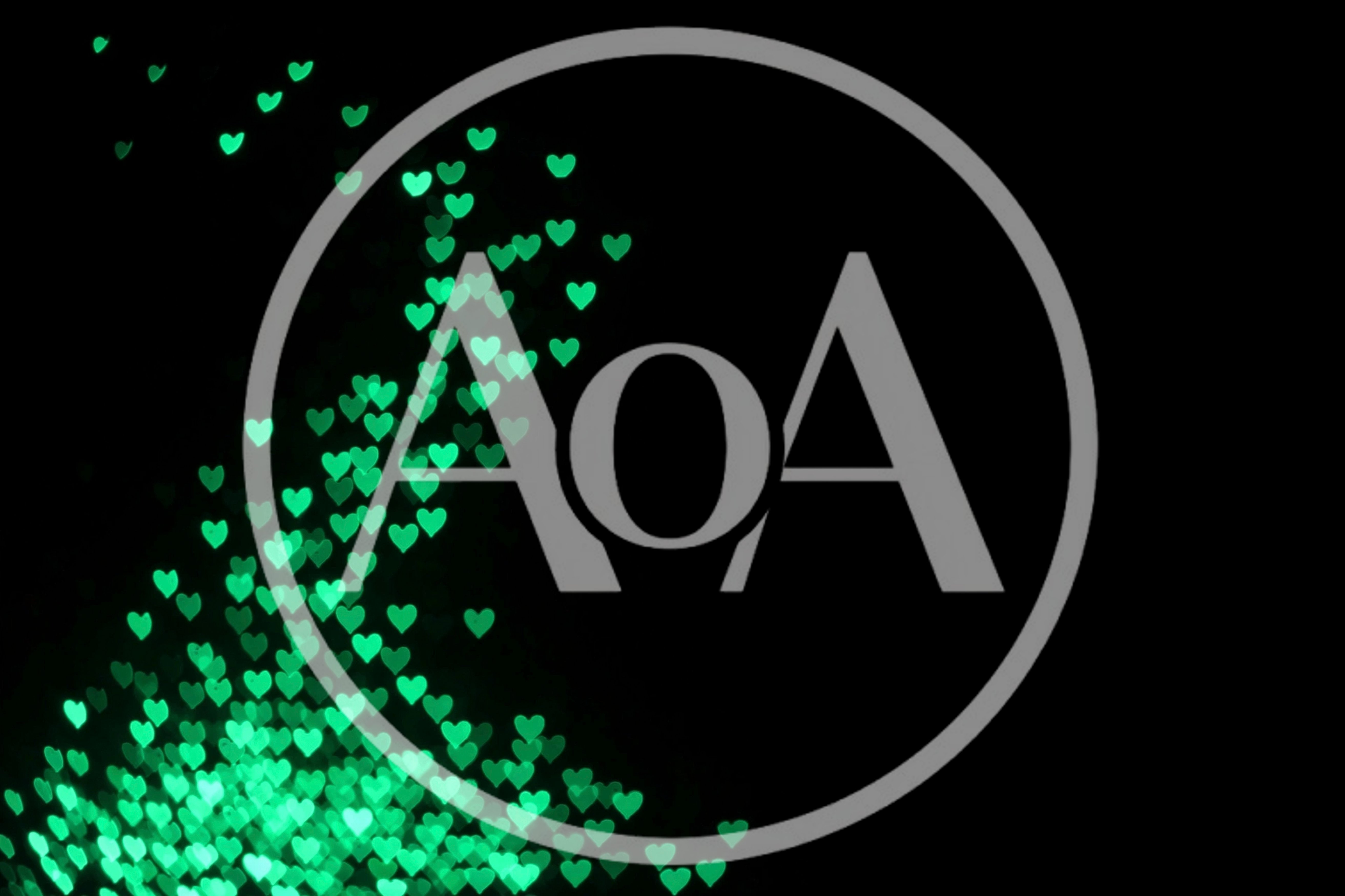 Green Heart Shaped Bokeh Lights On Black Background