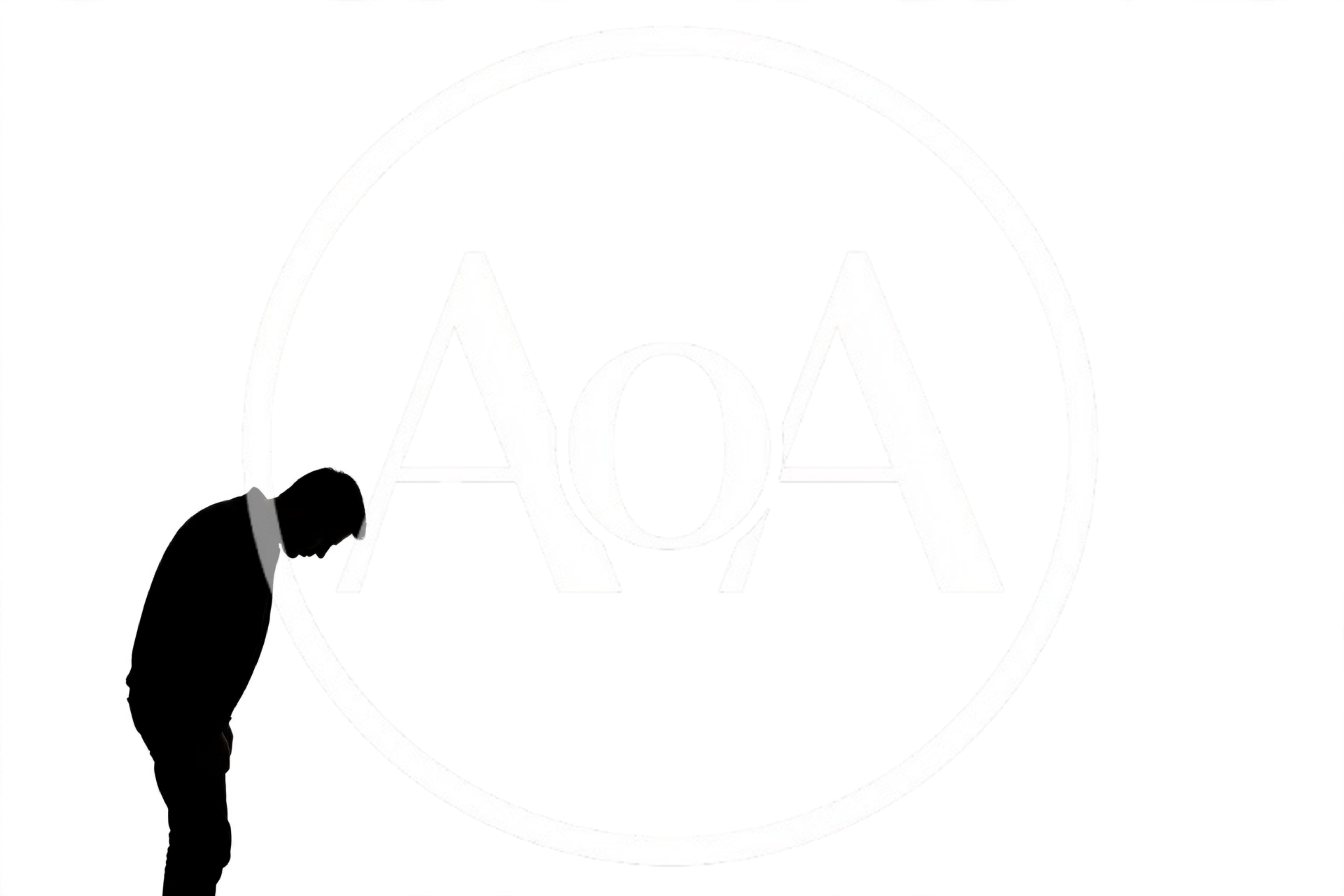 Silhouette Of A Man Bowing His Head In Sorrow