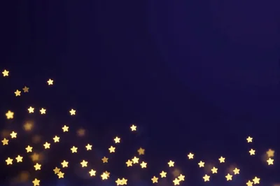Star Shaped Bokeh Lights On Dark Blue Background