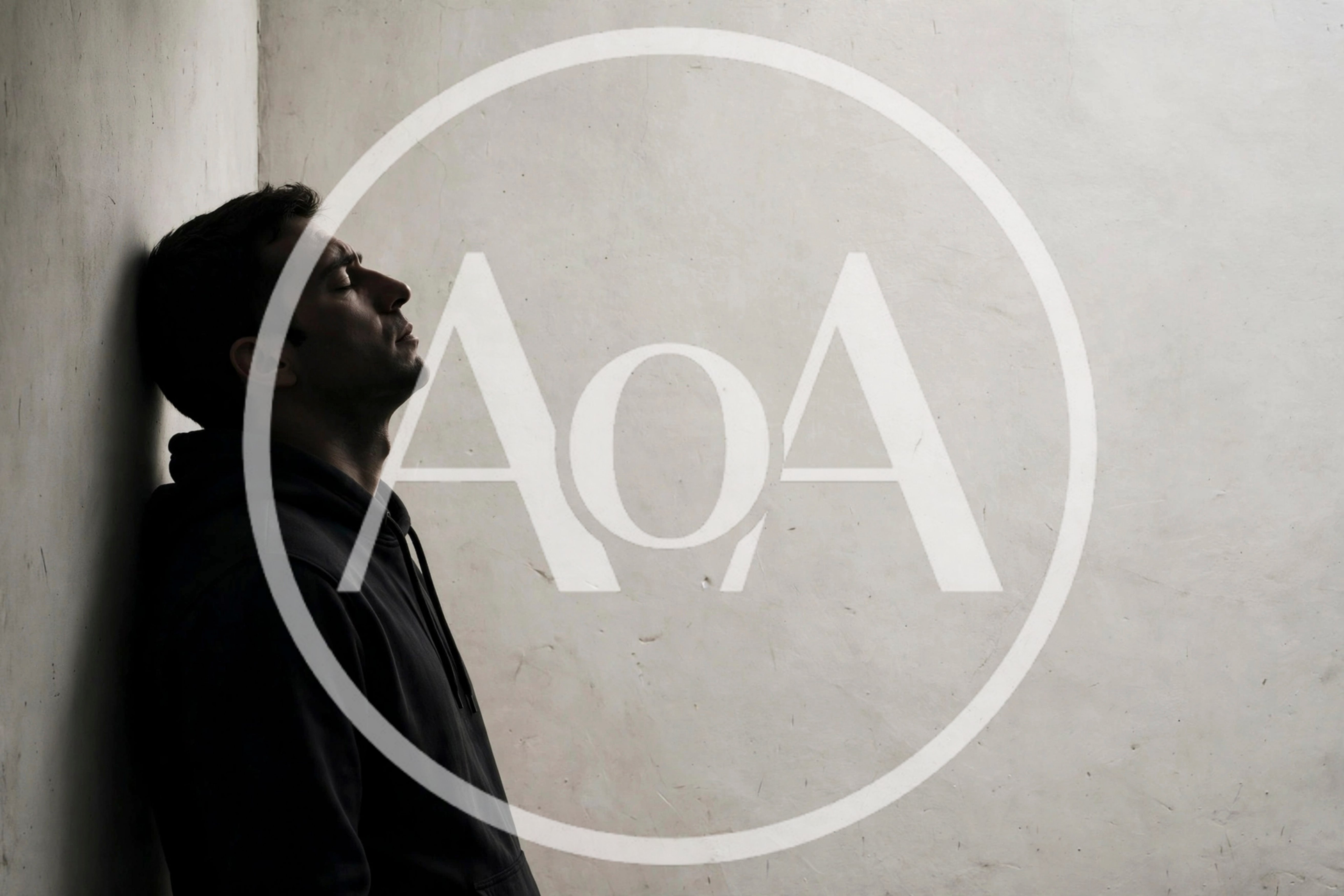 Depressed Man Leaning Against A Wall