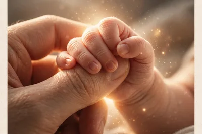 Close Up Of An Adult Holding A Newborn Baby Hand