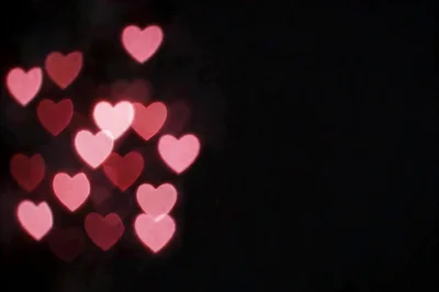 Pink Heart Shaped Bokeh Lights On Black Background