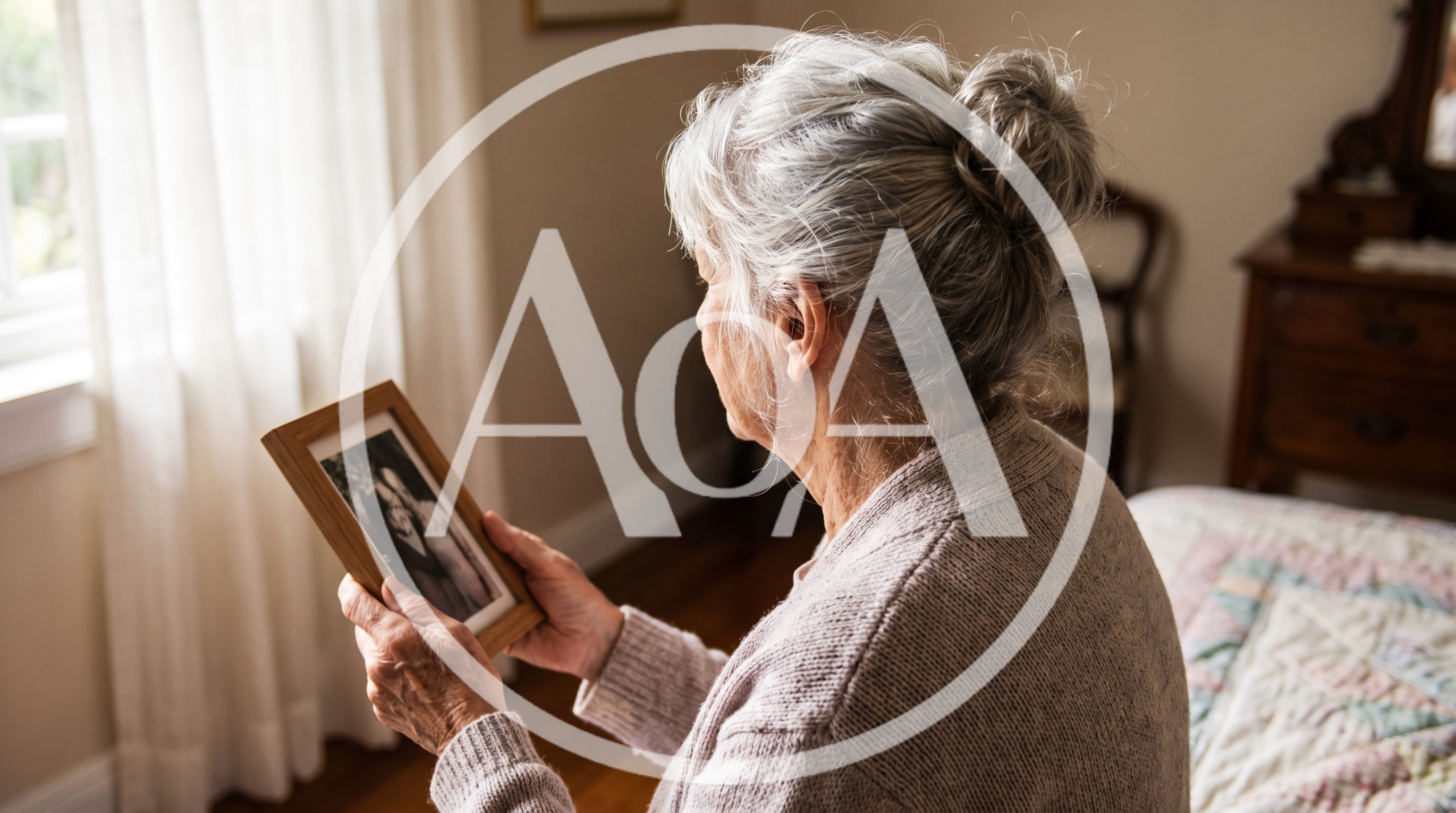 Elderly Woman Looking At A Framed Photograph