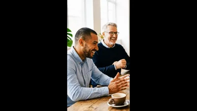 Two Businessmen Laughing During A Meeting