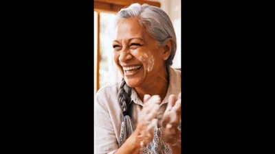 Happy Senior Woman Baking With Flour In Kitchen
