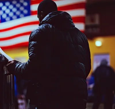 Man Voting at a Polling Station