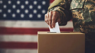 Military Personnel Casting Vote in Ballot Box