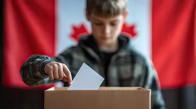 Young Boy Casting A Ballot In A Canadian Election