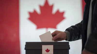 Person Casting A Ballot In A Canadian Election