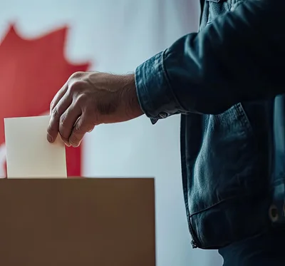 Person Casting A Ballot In A Canadian Election