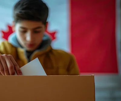 Young Man Casting Ballot in Canadian Election