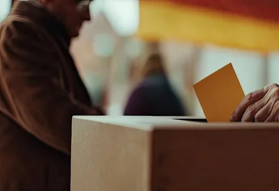 Elderly Person Casting Vote in Ballot Box