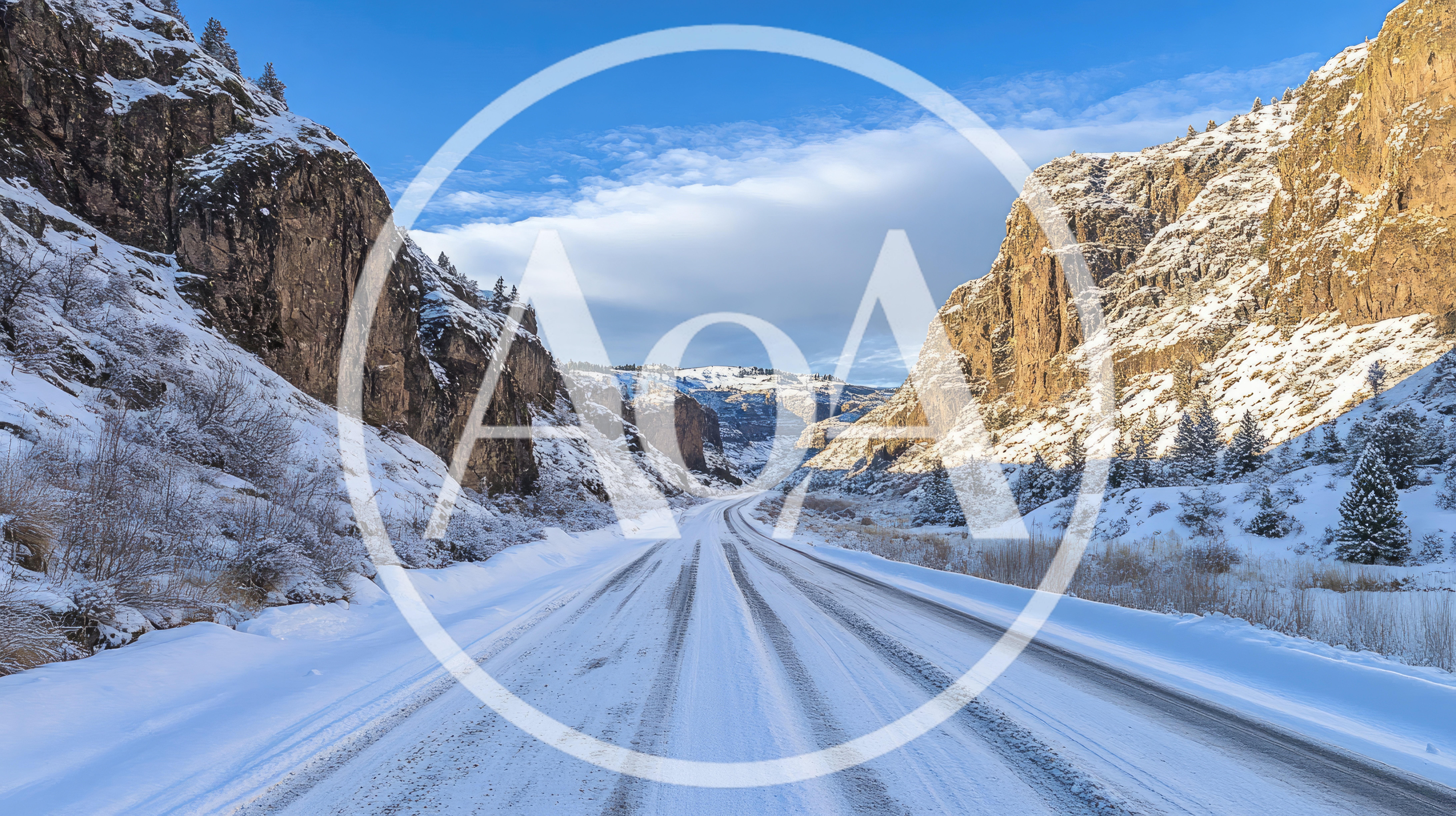 Snow Covered Road Through A Mountain Canyon