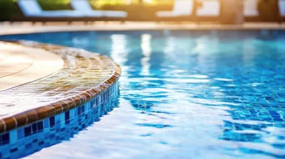 Close Up Of Swimming Pool Edge With Rippling Water