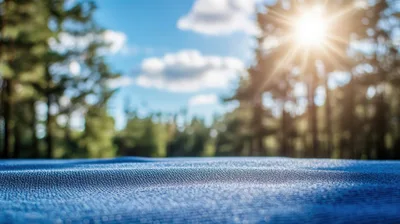 Blue Fabric Surface With Blurred Forest Background