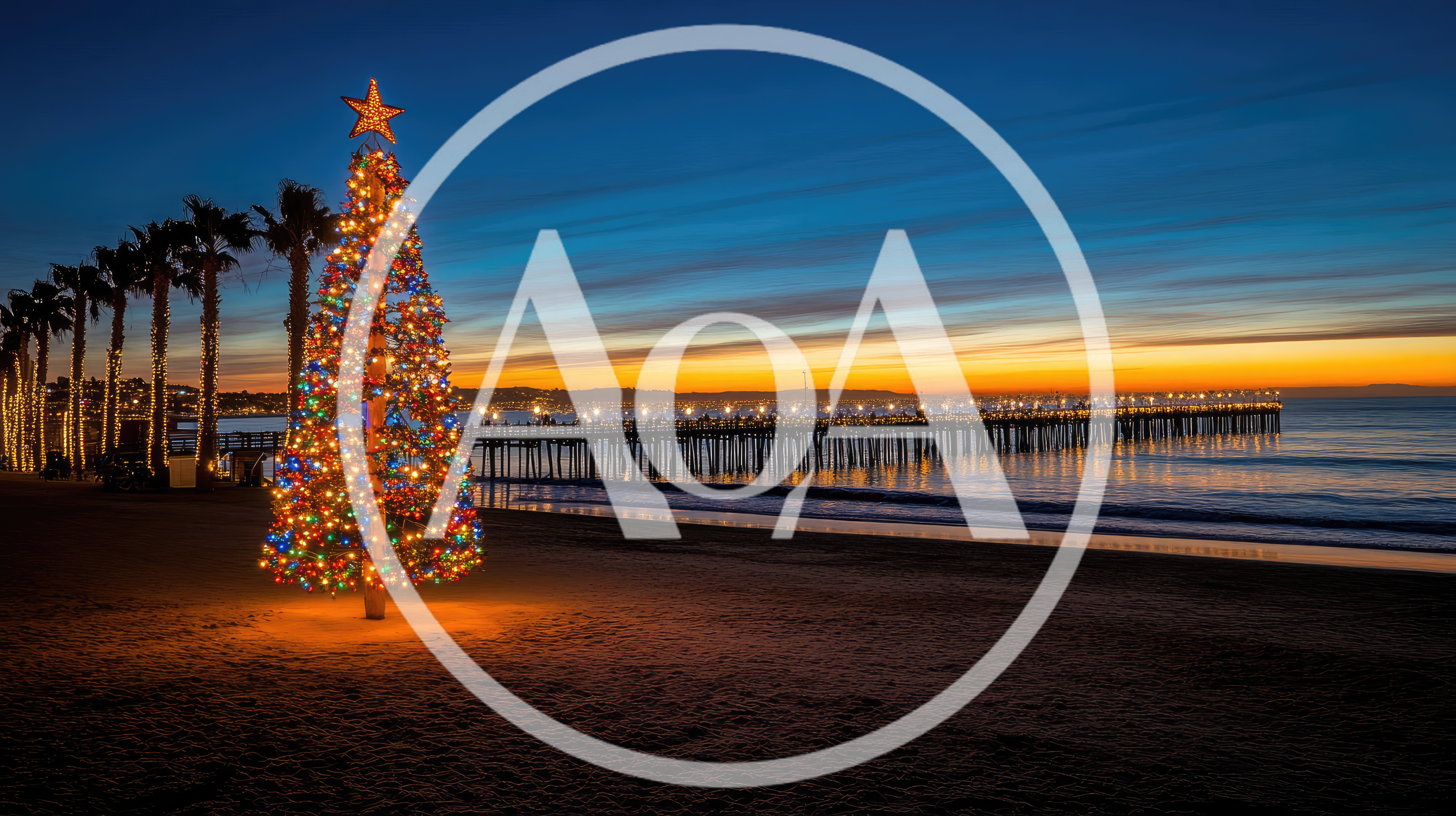 Illuminated Christmas Tree On Beach At Sunset