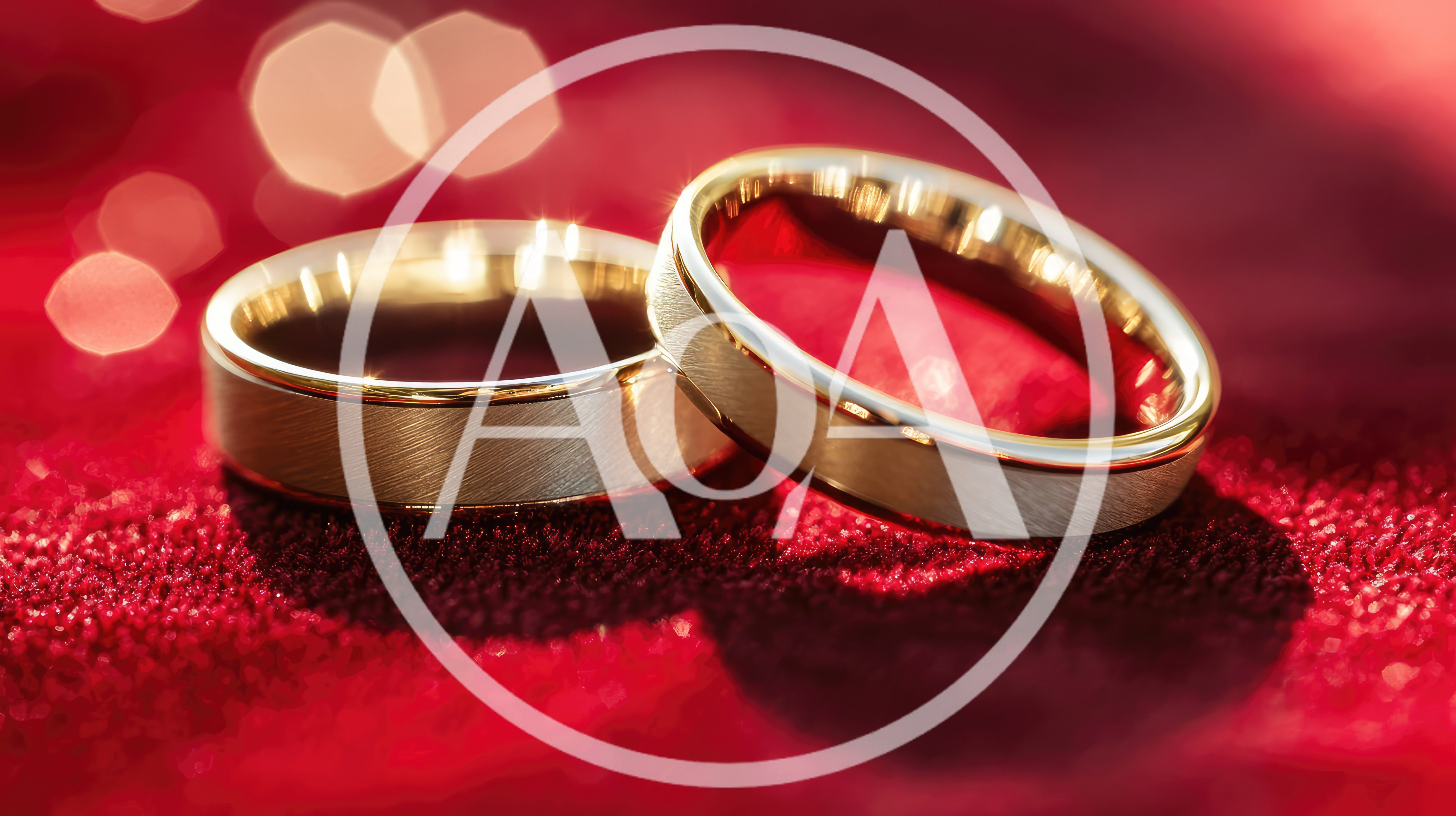 Two Gold Wedding Rings On Red Velvet Fabric