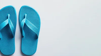 Pair Of Bright Blue Flip Flops On White Background