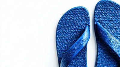 Pair Of Blue Rubber Flip Flops On White Background