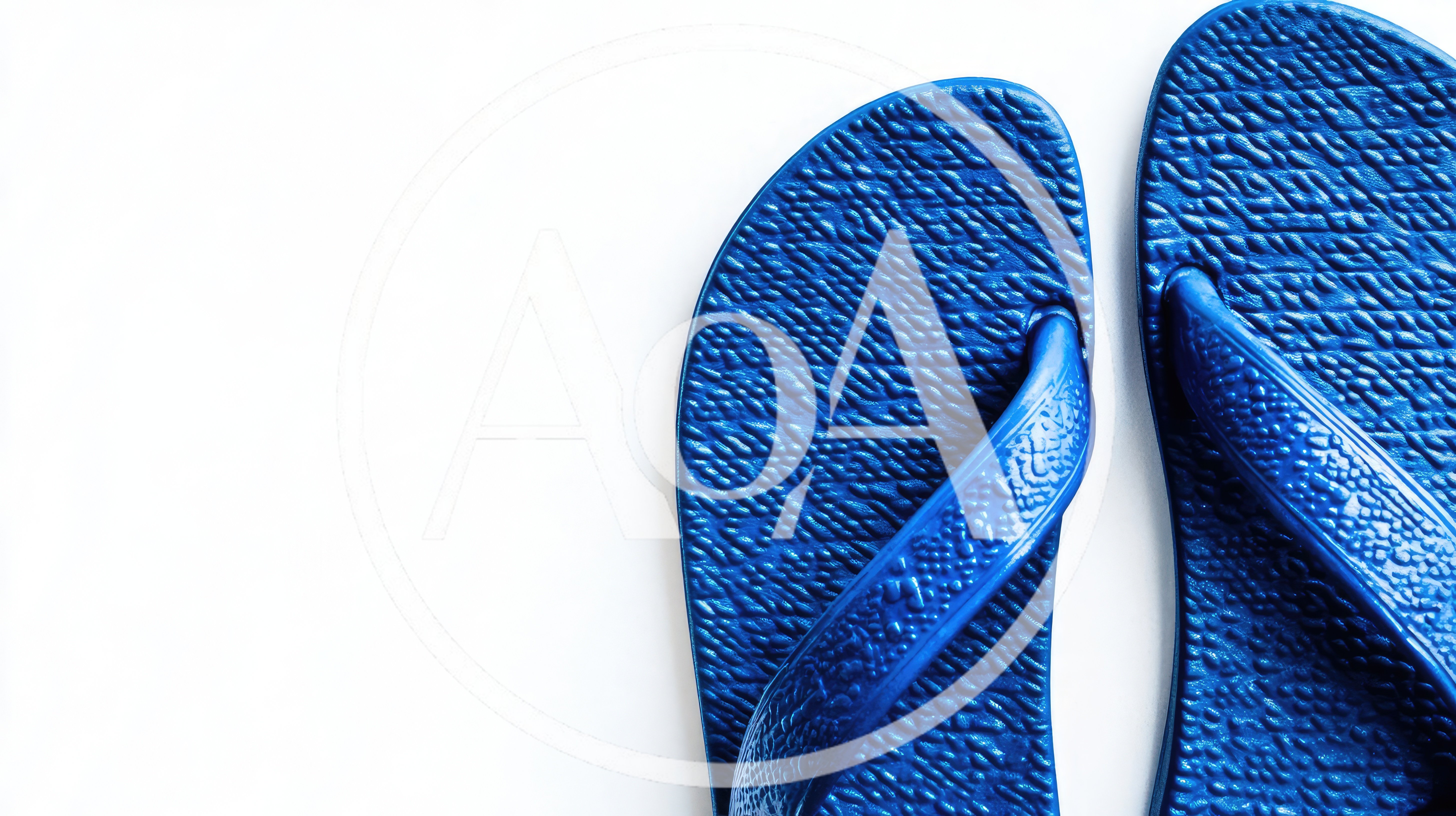 Pair Of Blue Rubber Flip Flops On White Background