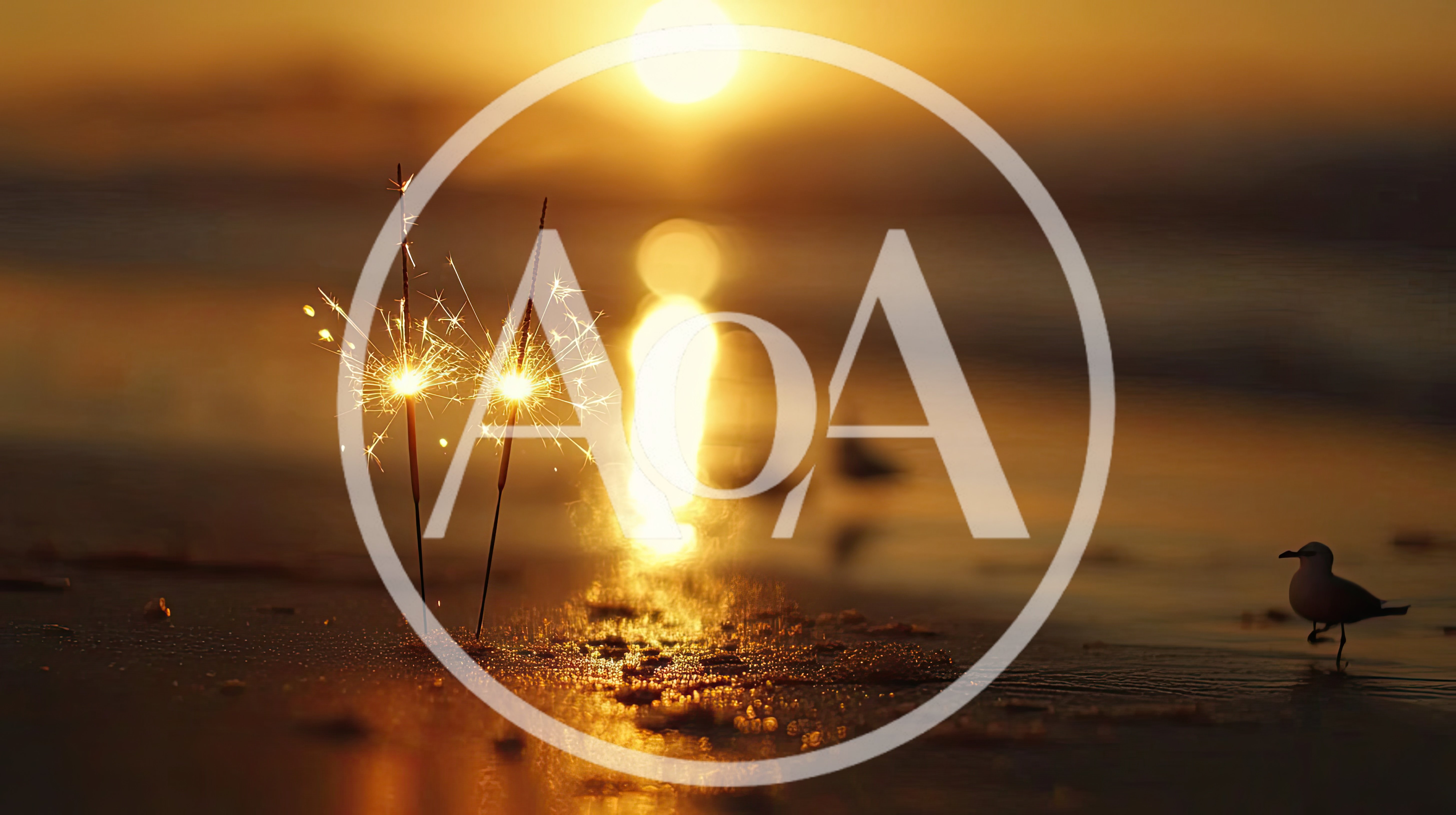 Two Burning Sparklers on a Sandy Beach at Sunset