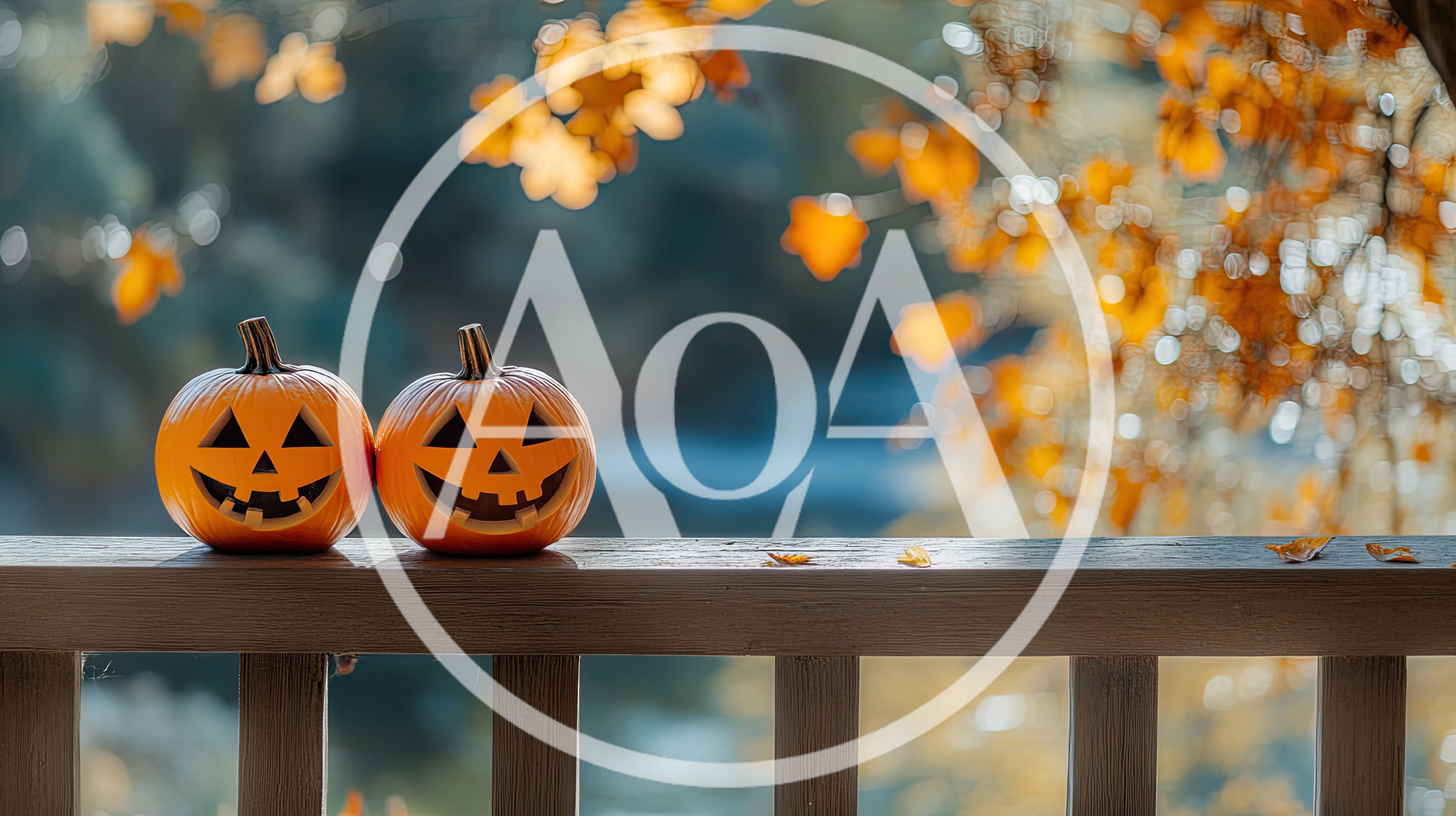 Two Jack-O-Lanterns Sitting On A Wooden Porch Railing