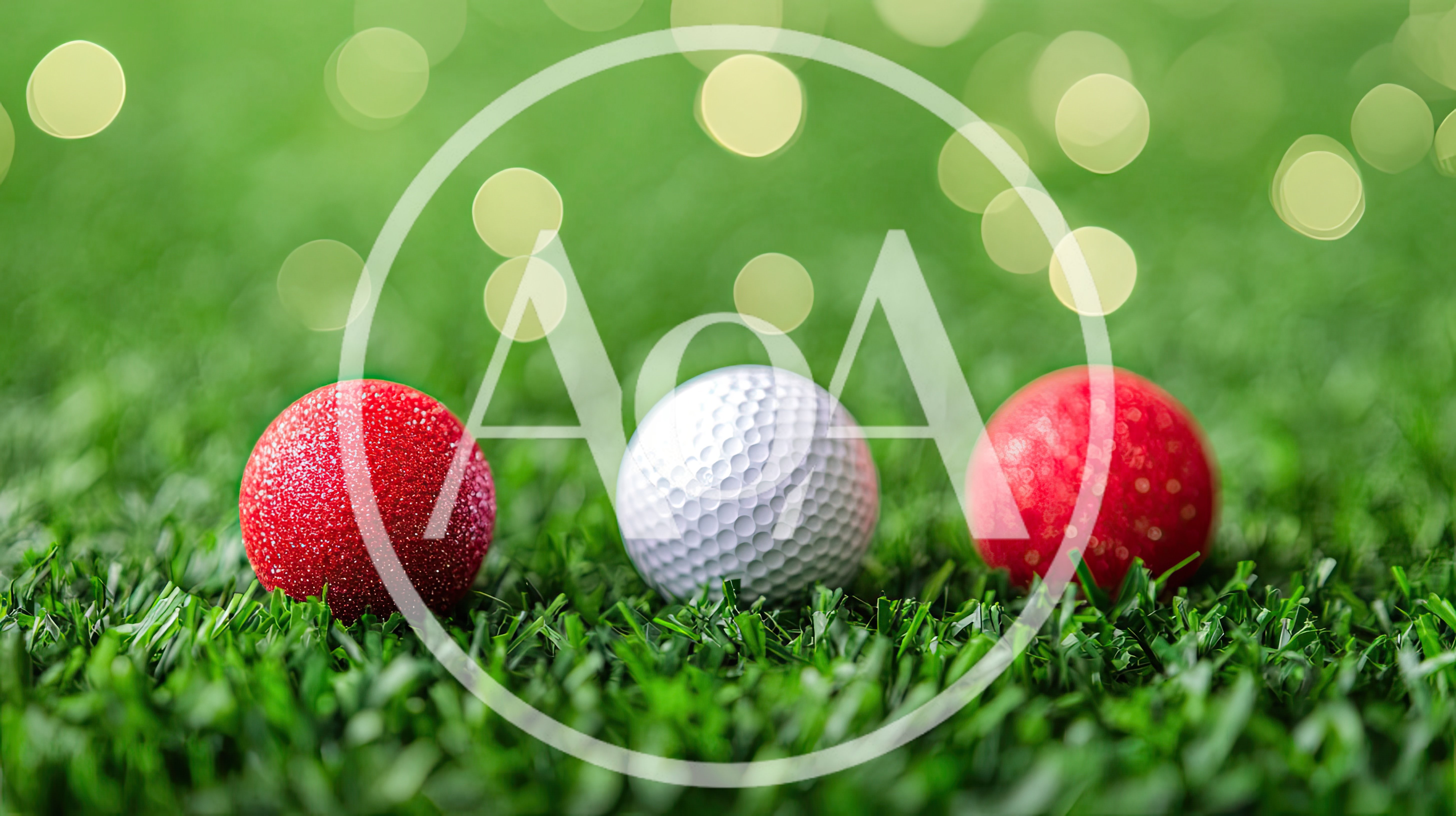 Red Christmas Ornaments and Golf Ball on Grass