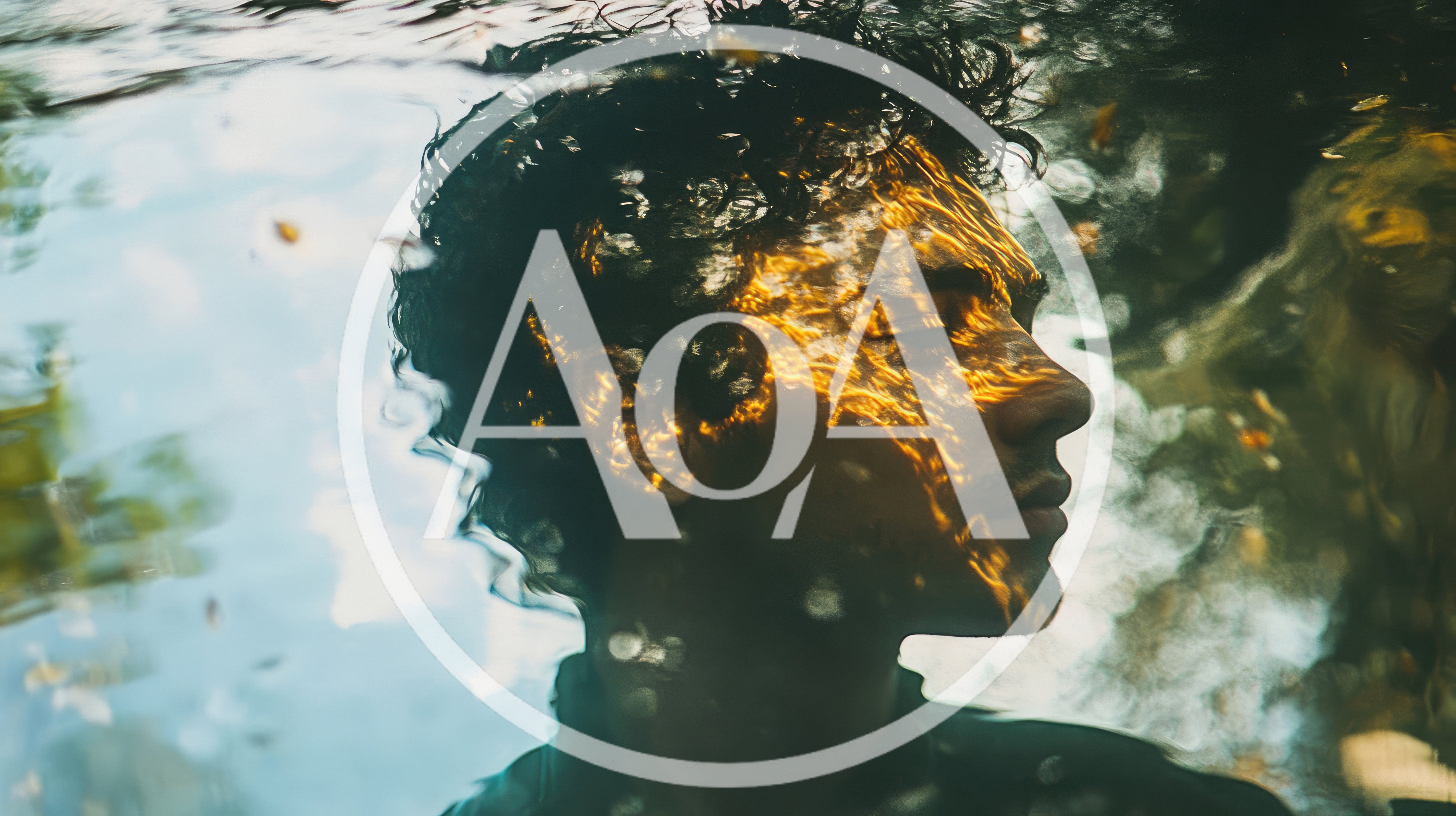 Young Man Submerged Underwater With Golden Sunlight Reflections