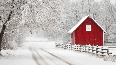 Red Barn Beside A Snowy Country Road