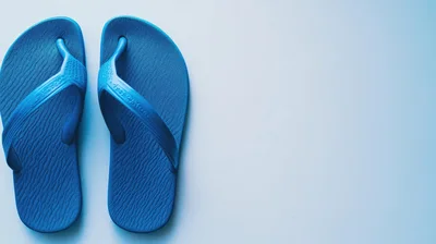Pair Of Blue Rubber Flip Flops On White Background