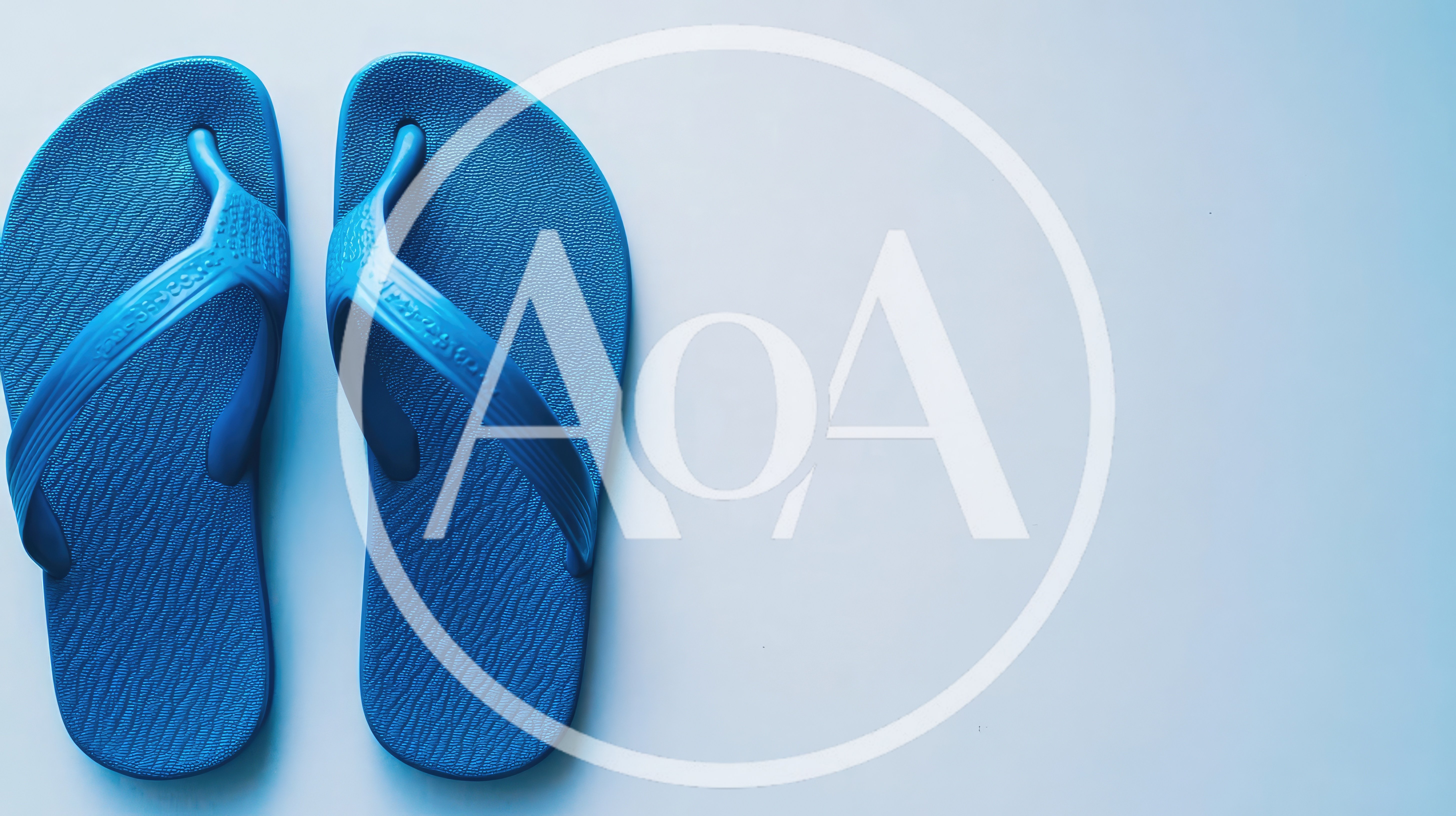 Pair Of Blue Rubber Flip Flops On White Background