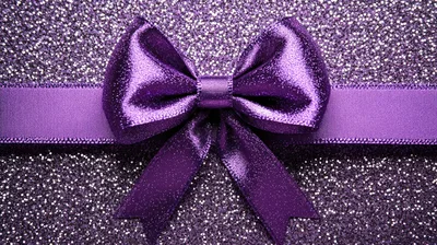 Purple Glitter Background With A Decorative Satin Bow