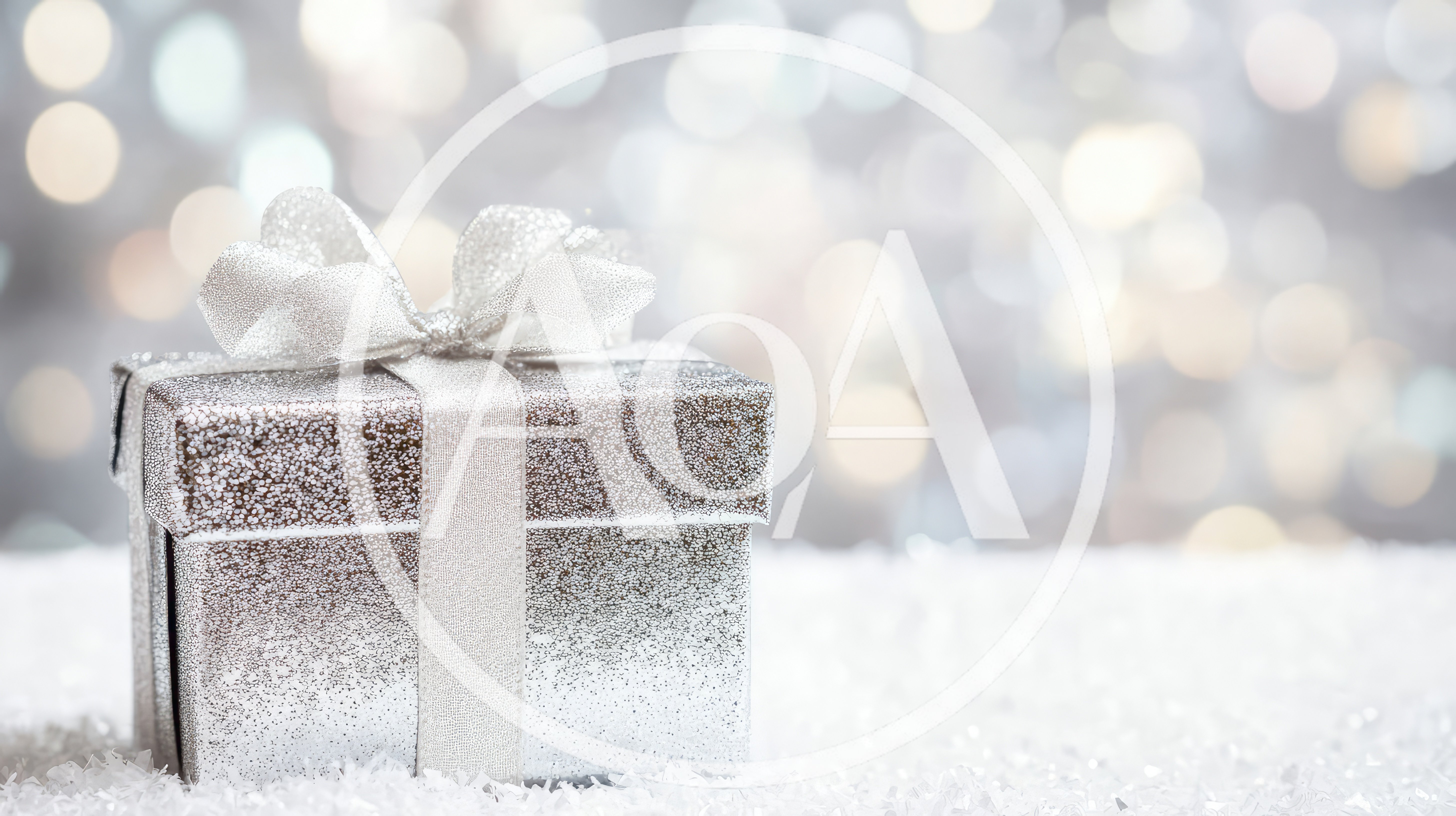 Silver Gift Box With Ribbon On Snowy Surface