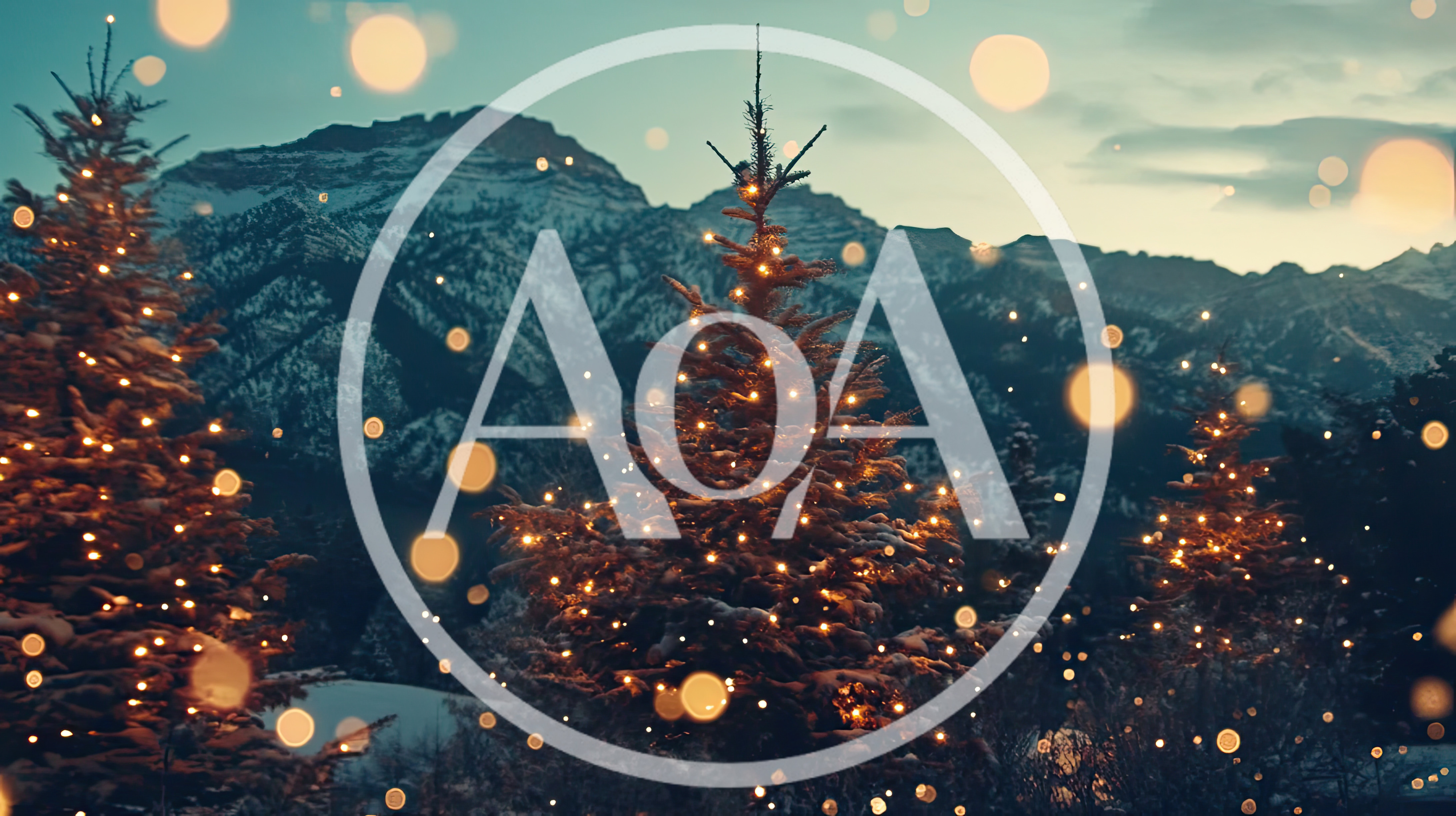Illuminated Christmas Trees Against Snowy Mountain Landscape