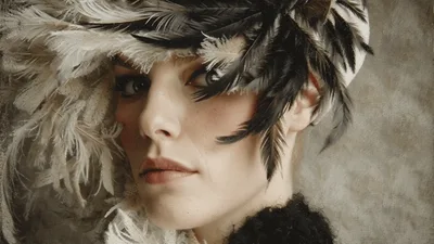 Portrait Of A Woman Wearing A Feather Headdress