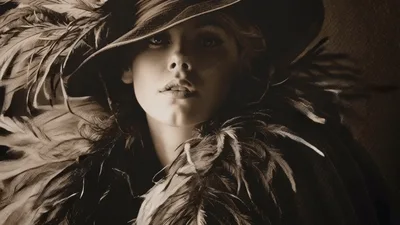 Elegant Woman In Vintage Hat And Feather Boa